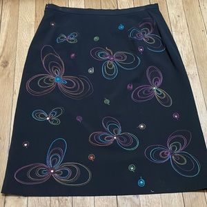 New worn Black skirt fully lined Multi color flowers front/back.